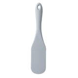A light gray silicone kitchen utensil spatula with a rounded handle, a flat and wide flexible blade, and a small hole at the top for hanging, photographed on a white background.
