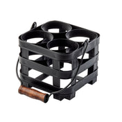 A black, square-shaped galvanized steel caddy from the TableCraft Forge Collection, with four circular compartments, a wooden handle on a wire frame, and open horizontal slats; perfect as a squeeze bottle caddy. Background is plain white.