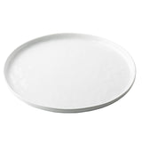A plain, round white TableCraft Ridge Collection Serving Plate with a slightly raised edge, photographed on a white background. The plate is completely empty and features a smooth, glossy finish.