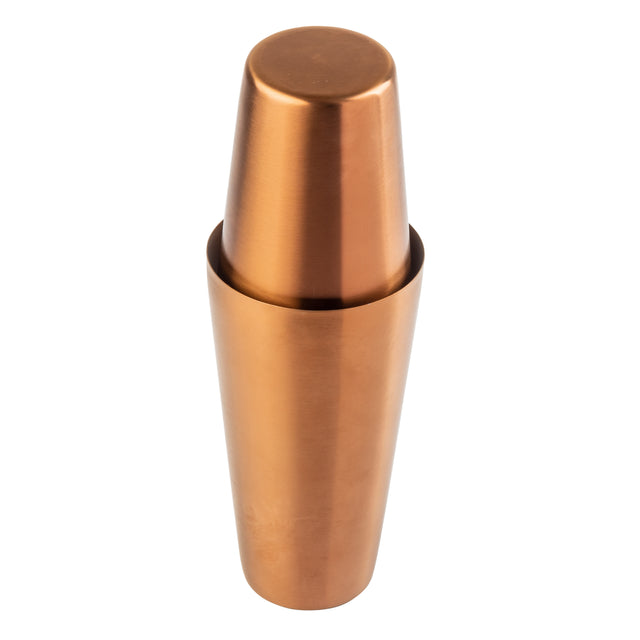 A stainless steel cocktail shaker with a shiny bronze PVD finish is shown on a white background. The shaker consists of two parts, with the smaller cup fitted upside down into the larger cup. The surface appears smooth and reflective.