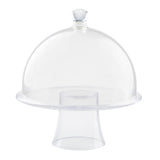 A clear, empty TableCraft glass cake stand with a domed lid and round handle on top. The stand has a circular base supporting a flat plate, while the transparent cake dome covers the plate. The background is white.