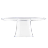 A clear cake stand with a smooth, flat top and a thick, slightly flared pedestal base is photographed against a white background. The simple, elegant design highlights the transparency and shine of this round cake stand.