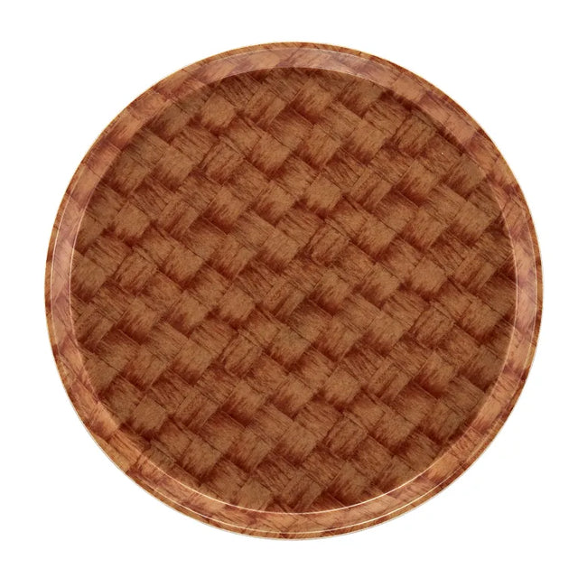 Round Serving Camtray featuring a brown, basket-weave pattern. This fiberglass tray has a glossy finish, is dishwasher safe, and its textured design offers a rustic look with wood-like shades of brown and a slightly raised edge.