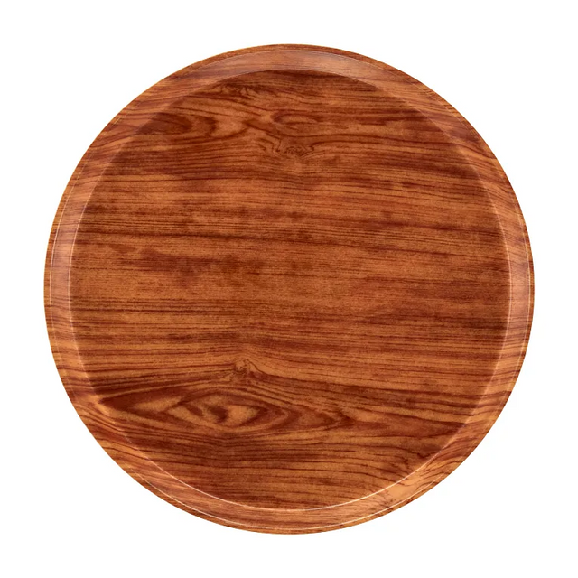 A 12 inch round serving Camtray featuring a smooth finish and visible wood grain patterns. The reddish-brown fiberglass tray has a slightly raised rim, with an unadorned surface that highlights the natural wood texture.