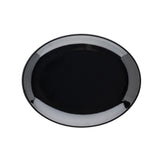 A round, glossy black ceramic plate seen from above against a white background. The surface is smooth and reflective, echoing the simple, modern design of the Sierra Collection Serving Platter with no decorations or patterns.