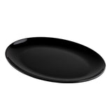 A glossy, oval-shaped black serving platter from the Sierra Collection is shown against a plain white background. The empty melamine plate is slightly tilted with smooth, curved edges, reflecting light near the rim and upper left side.