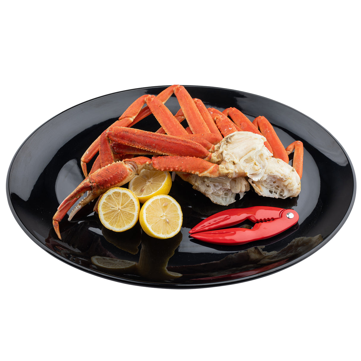 A black Sierra Collection Serving Platter holds steamed crab legs, lemon slices, and a red seafood cracker tool, all arranged neatly on a white background.