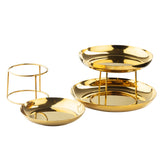 Three shiny gold finish serving trays are shown: one resting on the surface, one on a gold stand, and one elevated like a Seafood Tower. All trays are round with smooth, reflective surfaces and arranged against a white background.