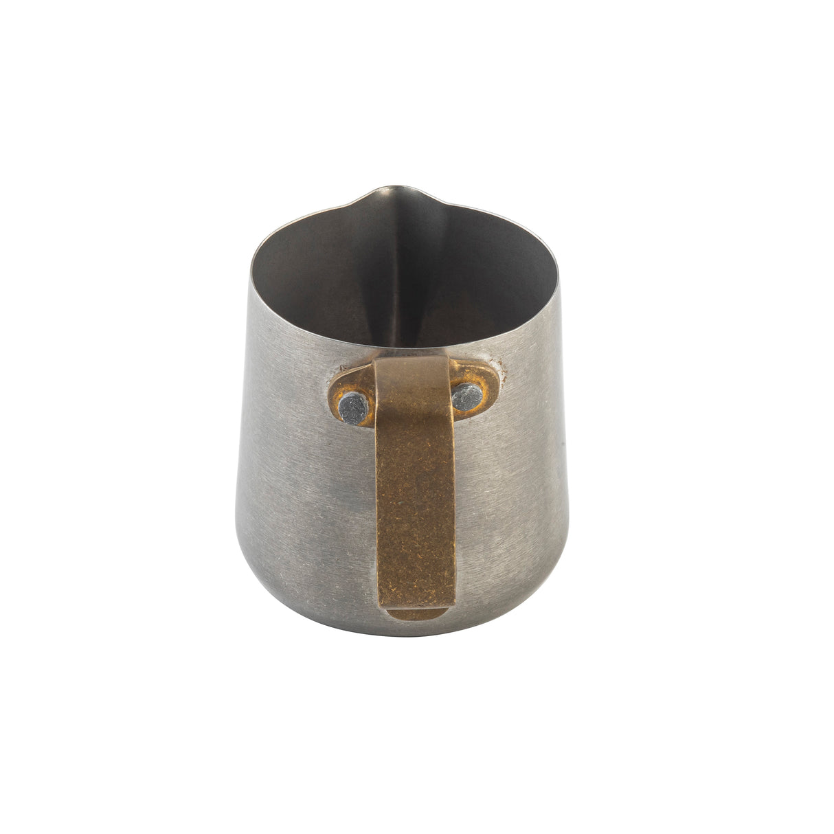 A small stainless steel frothing cup with a matte finish, featuring a wide spout and a sturdy, angular brass handle attached with two visible rivets. The minimalist, industrial pitcher is photographed on a white background.