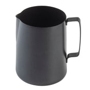 A matte black stainless steel frothing cup with a wide cylindrical body, a smooth rounded base, and a sturdy handle attached vertically. The pitcher has a small spout for pouring and is photographed against a white background.