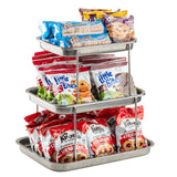 The Sharing Tower features a 3-tier stainless steel stand filled with snacks: packaged cookies on top, Little Bites muffins in the middle, and Knott’s Berry Farm Strawberry cookies below—all neatly organized for easy sharing.