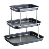 A 3-tier Sharing Tower with rectangular black trays and stainless steel supports, staggered in height for versatile storage or display. The trays feature raised edges and are vertically arranged, creating open space between each tier.