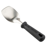 A stainless steel spatula with a wide, slightly curved, flat blade and a black, textured plastic handle featuring NSF certification and ergonomic PerfectGrip design for comfortable use. Handle is imprinted with text and includes a hole for hanging.