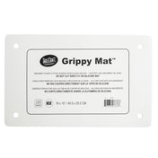 A white rectangular Grippy Mat Cutting Board by TableCraft, this anti-slip cutting mat features printed instructions in English, French, and Spanish, four reinforced corner holes, and measures 16 x 10" (40.5 x 25.5 cm).
