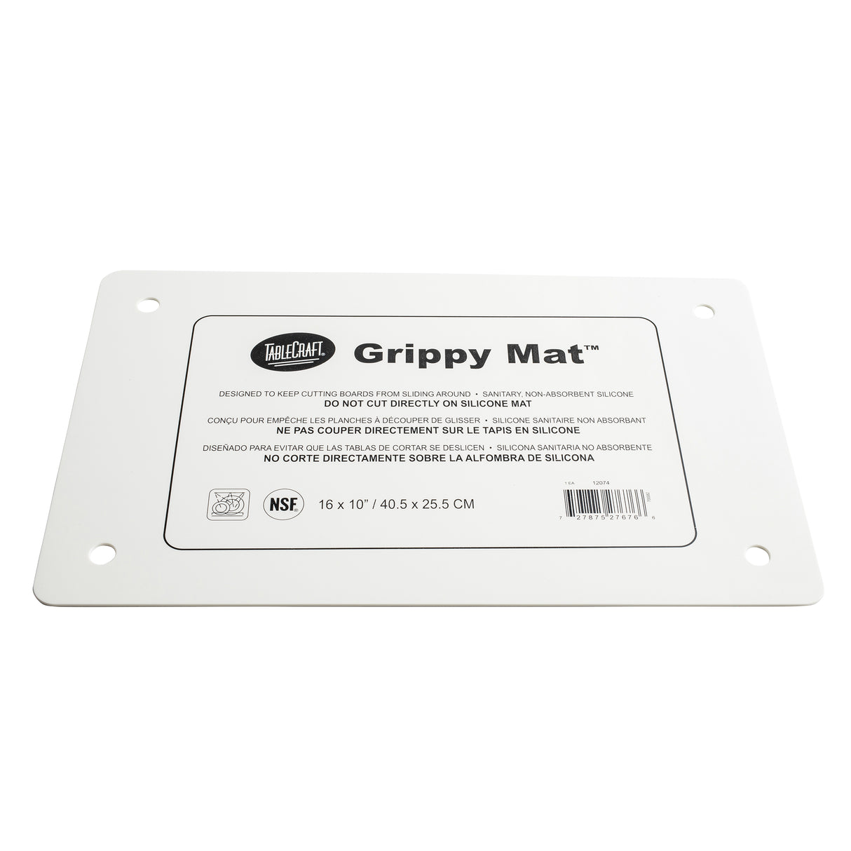A rectangular white silicone Grippy Mat Cutting Board with rounded edges, four corner holes, and a centered label displaying the TableCraft logo, product name, care instructions in three languages, NSF logo, and mat size: 16 x 10 (40.5 x 25.5 cm).