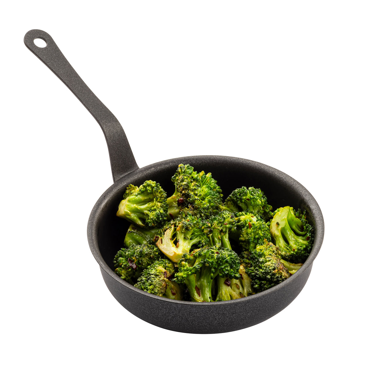 A black non-stick fry pan with a long handle holds cooked, browned broccoli florets. The pan and vegetables are isolated on a white background, with the broccoli appearing perfectly roasted or sautéed.