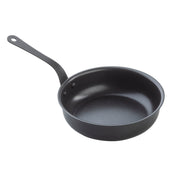 A black TableCraft Mini Serving Fry Pan with a non-stick coating, long handle, gently sloping sides, and a smooth interior. Features a small hole at the end of the handle for easy hanging, set against a white background.