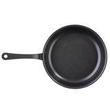 A black TableCraft Products non-stick fry pan with a smooth, round base and slightly sloped sides is shown from above. It features a long, straight handle with a hole for hanging and rests empty on a white background.