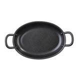 A black, oval-shaped TableCraft Products cast iron pan with two large handles on each end, viewed from above. The interior surface is smooth and slightly textured, resembling a non-stick fry pan, and the pan sits on a white background.