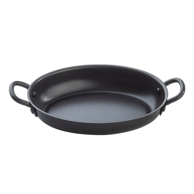 A black, oval-shaped TableCraft roasting pan with a non-stick coating and two sturdy handles sits on a plain white background. The smooth, shallow interior makes it ideal for baking or roasting, while the outward-curved handles offer easy gripping.