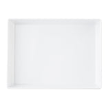 A large, empty, rectangular white ceramic tray with slightly raised edges is viewed from above on a plain white background. Its smooth surfaces and clean lines give it a modern, minimalist appearance—perfect for pairing with a Simple Solutions Bowl.