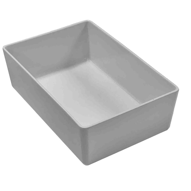 A plain, white, rectangular TableCraft 12100 ceramic dish with straight sides and rounded corners, viewed from an angle above. The dish is empty and set against a white background.