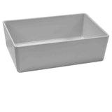 A rectangular, white Simple Solutions Bowl with straight sides and rounded edges, crafted from ceramic or porcelain, is viewed at a slight angle and sits elegantly on a white background.