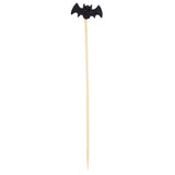 A wooden cocktail stick, part of the TableCraft 12141 Halloween bamboo picks collection, features a black bat-shaped decoration with outstretched wings. The decorative pick is pointed at the bottom and set against a plain white background.