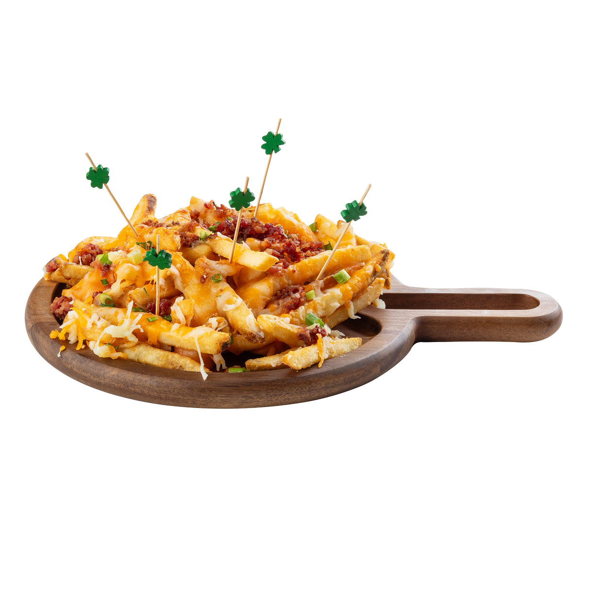 A wooden serving board holds loaded fries topped with melted cheese, bacon bits, and green onions. Several TableCraft bamboo decorative picks with small green shamrock decorations are inserted into the fries. The background is white.