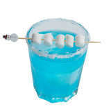 A glass of bright blue drink with a sugared rim, topped with five mini marshmallows on decorative picks and a small snowman decoration. The glass is set against a plain white background—perfect for showcasing festive holiday party supplies.
