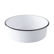 A white, round enamel bowl with a smooth surface and a black rim sits on a plain white background. This minimalist TableCraft Products melamine serving bowl features gently sloping sides and a classic, timeless appearance.