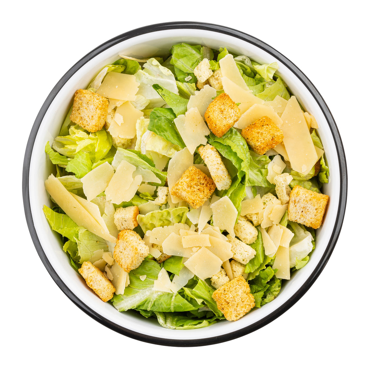 A white TableCraft serving bowl filled with Caesar salad, featuring chopped romaine lettuce, golden croutons, and wide shavings of parmesan cheese, all arranged neatly on a white background.
