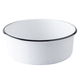 A plain white TableCraft enamel serving bowl with a black rim sits on a white background. The round, deep bowl features a smooth, glossy surface, giving it a classic, minimalist appearance perfect for versatile serving needs.