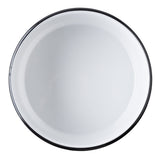 A round, empty, white enamel TableCraft plate with a thin black rim is viewed from above against a white background. The plate’s surface is smooth and glossy, with subtle reflections visible.