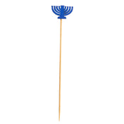 A wooden skewer from TableCraft Products with a blue menorah decoration made of paper or plastic at the top. This decorative pick features a stylized nine-branch menorah, symbolizing Hanukkah, set against a plain white background.