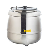 A shiny, stainless steel Soup Kettle Warmer (10.5 qt.) with a black handle on the hinged lid sits on a white background. A yellow Caution Hot sticker is on the front, and three small feet support the kettle as its surface reflects light.