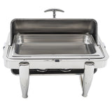 A full size chafer with a raised lid, rectangular food tray, and sturdy curved legs. This stainless steel chafer features a modern, polished finish and two burners below to keep food warm.