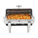 A full size stainless steel chafer filled with mixed cooked vegetables, including carrots, peas, and corn. The dripless roll top lid is propped open, showcasing the colorful food. Sturdy legs and two fuel burners are visible underneath.