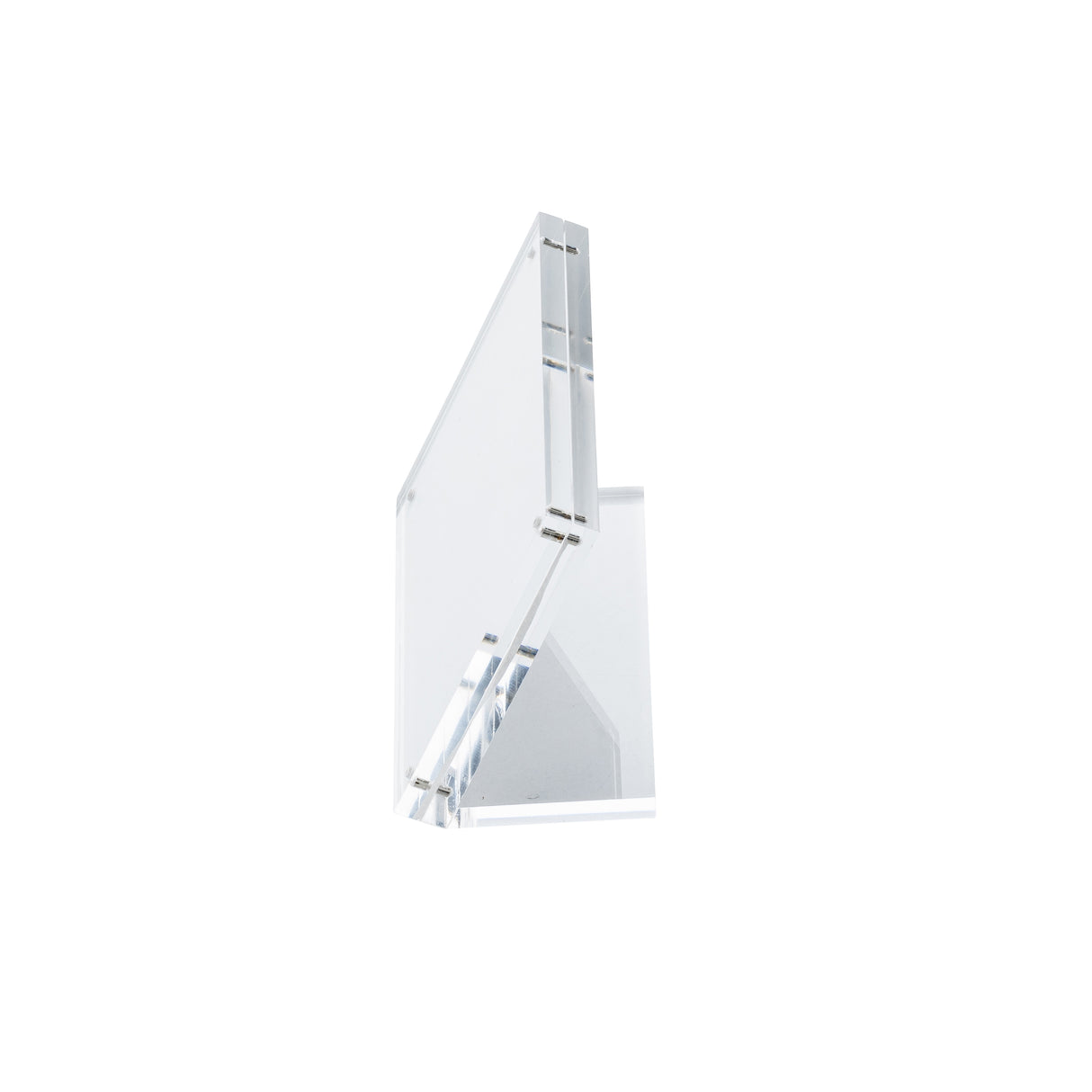 A clear, rectangular TableCraft acrylic sign holder is shown against a plain white background. Photographed at an angle, it highlights its transparent material and geometric design in a minimalistic setting with no visible objects held by the stand.