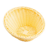 A round, empty handwoven basket is shown against a white background. The basket has a tightly woven pattern with a slightly flared rim and a natural light beige color. Its texture and pattern are clearly visible.