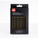 A black box of TableCraft cocktail picks is shown upright. The package displays 12 gold stainless steel picks with spherical tops visible through a window. White text on the box provides product name and details in English, French, and Spanish.