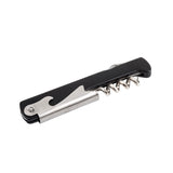 A waiter's corkscrew with a black plastic handle, metal bottle opener, and folded silver spiral is shown against a white background. This compact tool is perfect for opening wine bottles and bottle caps, and it's dishwasher safe.