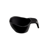 A black, matte-finish melamine scoop-shaped bowl with a wide opening, rounded sides, and an extended, ergonomic handle that curves downward. This modern, minimalist sauce boat is set against a plain white background.