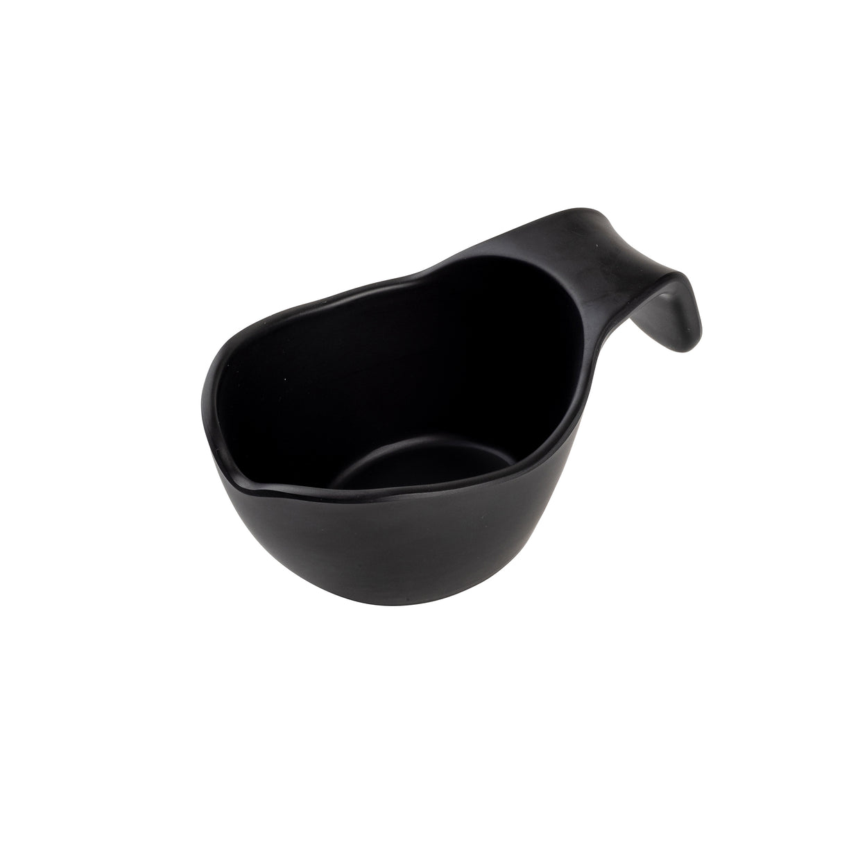 A matte black ceramic sauce boat with a rounded body and integrated, curved handle, shown angled on a plain white background. The thick, ergonomic handle and slightly tapered spout make pouring easy. Stackable for convenient storage.