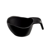 A black, matte-finished melamine bowl with a wide, shallow shape and a unique curved handle extending from one side for easy gripping. The stackable design is highlighted against a plain white background, emphasizing its modern functionality.