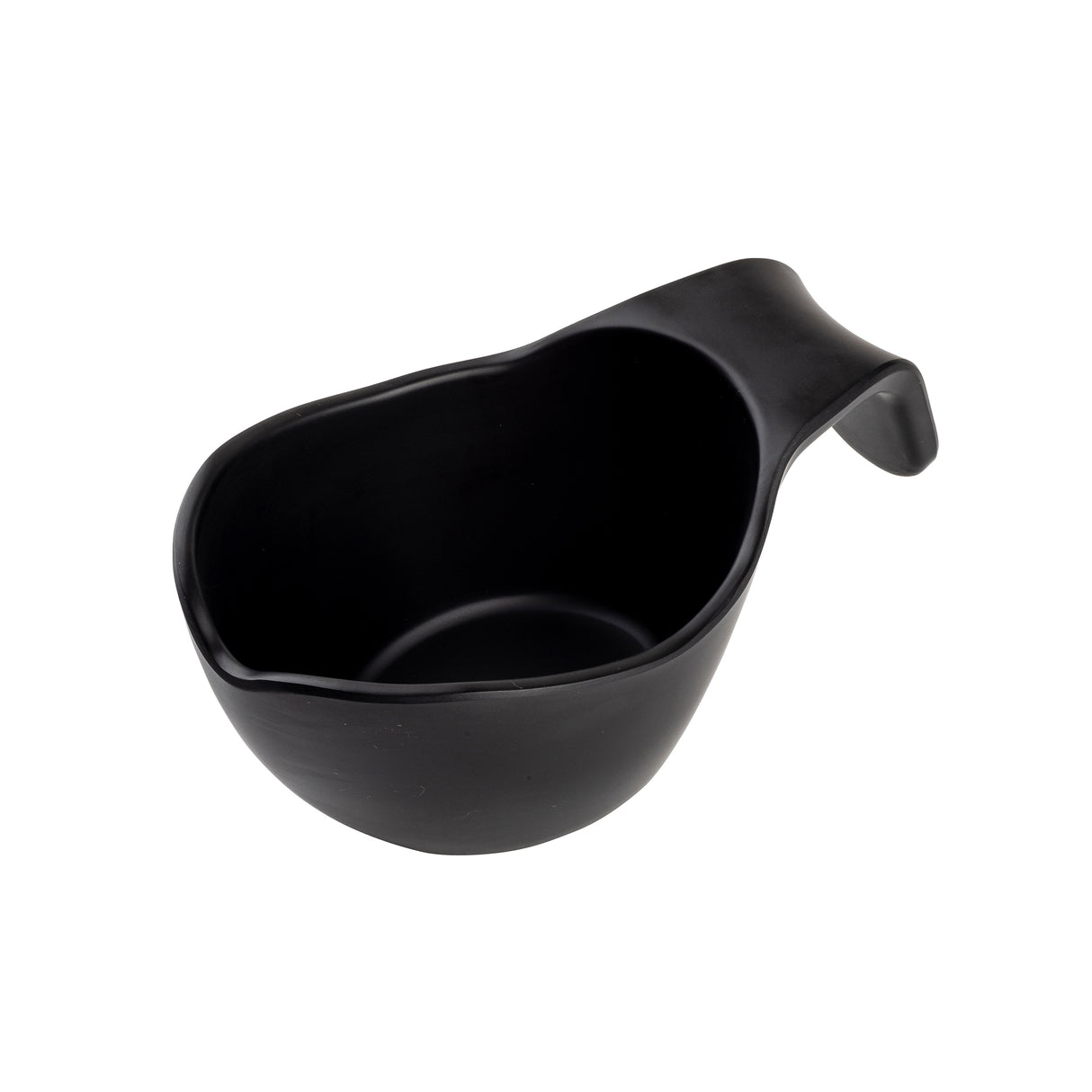 A black, asymmetrical TableCraft sauce boat with a curved handle on one end, photographed on a white background. The cup has a smooth matte finish and an organic, irregular shape, giving it a modern and minimalist appearance.