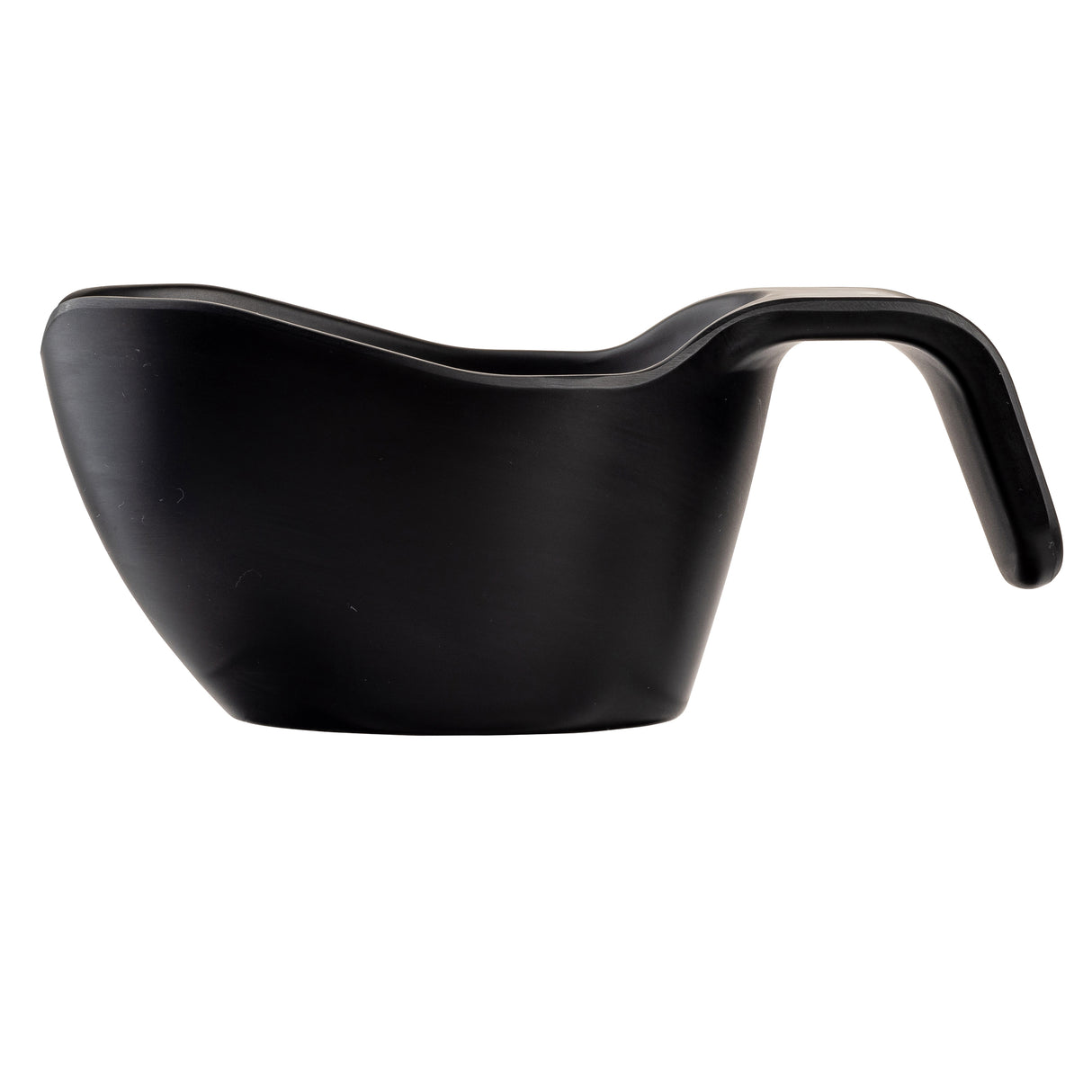 A black melamine measuring cup with a pouring spout and an integrated, curved handle extending from one side. The cup, reminiscent of a small TableCraft sauce boat, features a smooth matte finish and is photographed on a white background.