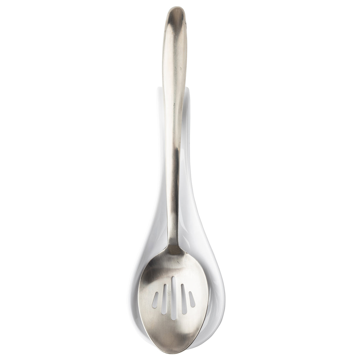 A stainless steel slotted spoon rests in a white ceramic spoon rest. The spoon has a rounded bowl with three rectangular slots and a long, curved handle. The image is taken from above on a white background, adding to the TableCraft appeal.