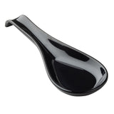A glossy black melamine soup spoon with a smooth, curved handle and wide, shallow bowl, designed for serving or eating soups. The spoon is placed on a white background, emphasizing its sleek and reflective surface.