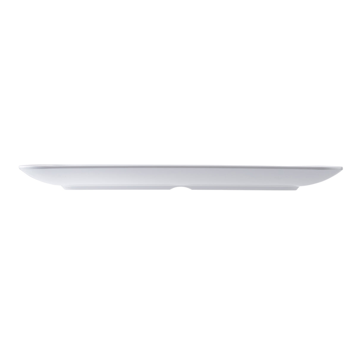 A plain, white, oval-shaped ceramic plate shown in a side view on a white background. The minimalist design is accentuated by its clean profile, reminiscent of the Sierra Collection serving platter’s smooth surface and slightly upturned edges.